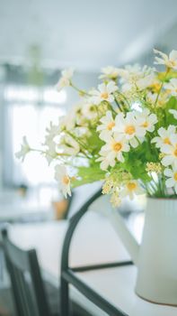 A bouquet of artificial flowers in pot