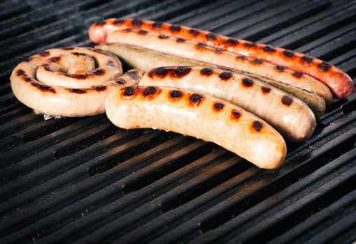 Closeup shot of sausages on a grill