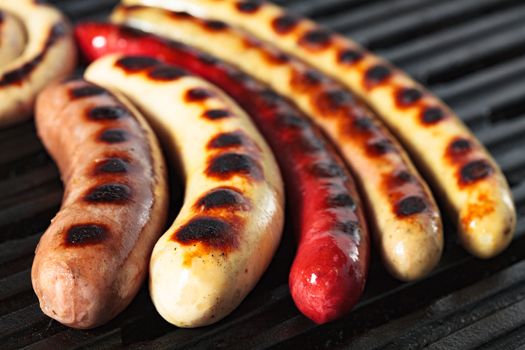 Closeup shot of sausages on a grill