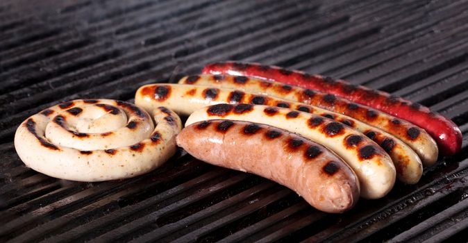 Closeup shot of sausages on a grill