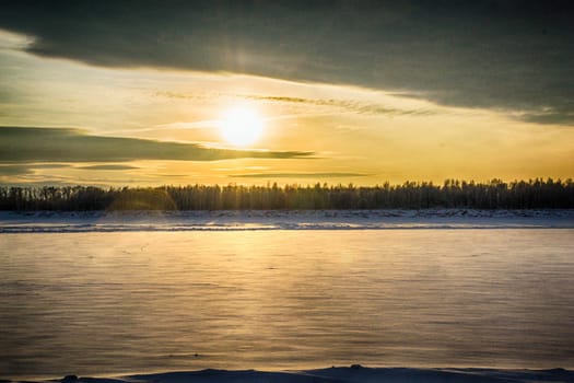 sunset on the river in winter river Dec frozen water forest