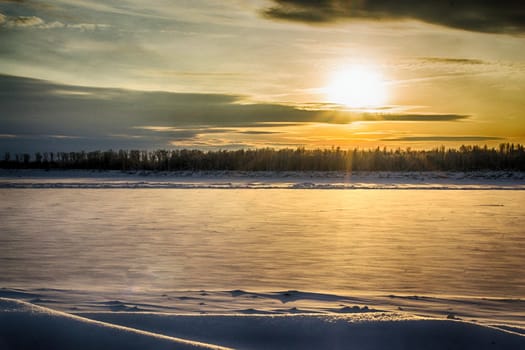 sunset on the river in winter river Dec frozen water forest