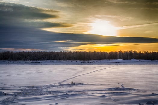 sunset on the river in winter river Dec frozen water forest