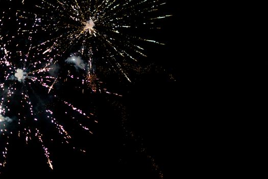 fireworks explosion of color on a dramatic black background focus