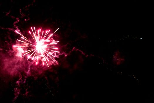 fireworks explosion of color on a dramatic black background focus