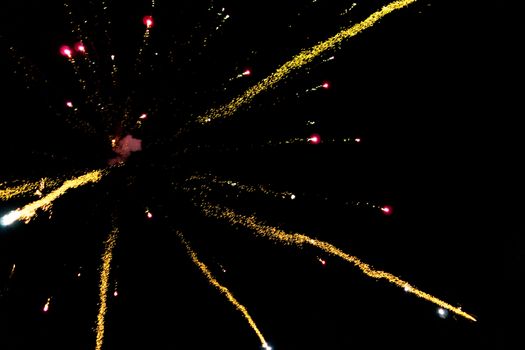 fireworks explosion of color on a dramatic black background focus