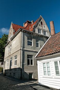 Historic houses in Stavanger against a blue sky, Norway