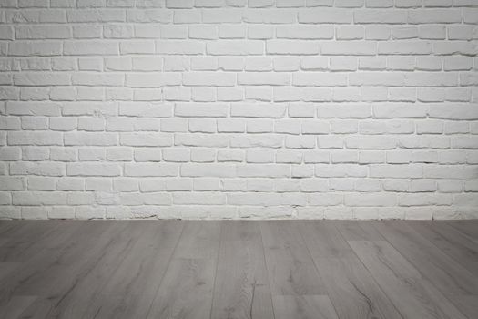 Old white brick wall and grey wood floor background