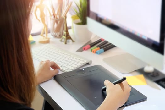 Graphic designer woman working on creative office with create graphic on computer.