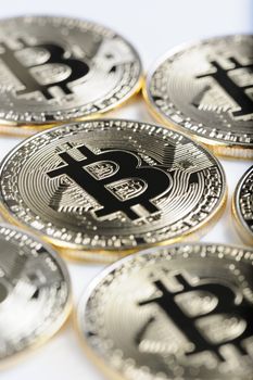 Macro view of shiny Bitcoin souvenire coins as background, selective focus