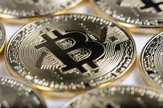 Macro view of shiny Bitcoin souvenire coins as background, selective focus