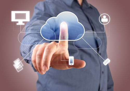 Close up of businessman touching cloud icon with finger