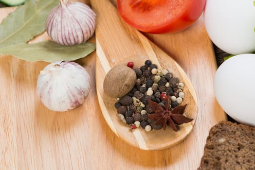 Set of vegetables and spices on kitchen table