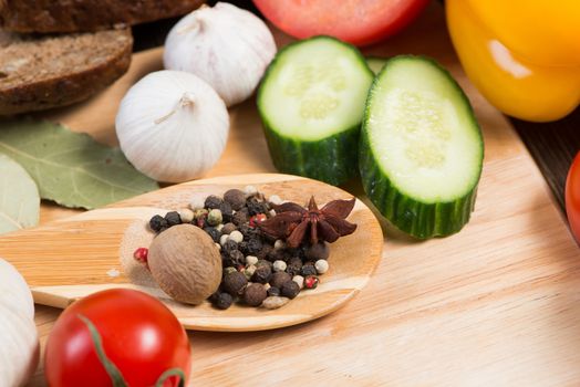 Set of vegetables and spices on kitchen table