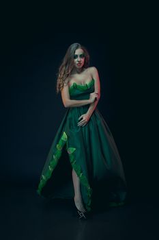 Fashion Art Portrait .Green Make-up and Colorful Bright Nails.