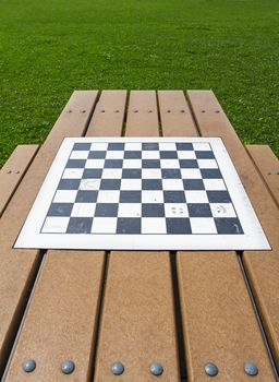 Checker board on a picnic table in a parc