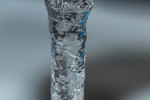 water macro photo of a water stream close-up squirt pours