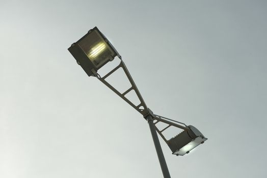 a street lighting pole taken from below