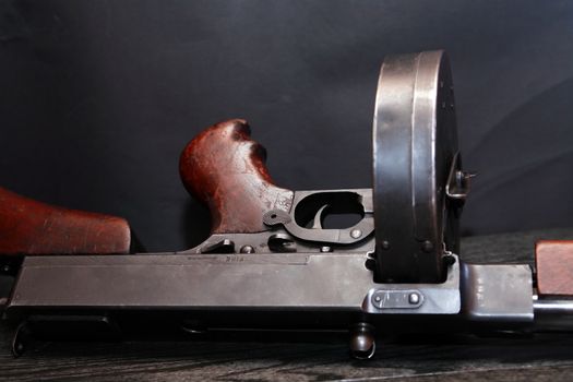 Old USA submachine gun closeup on dark background