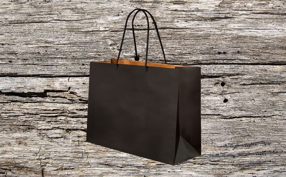 paper bag for shopping on a wooden background