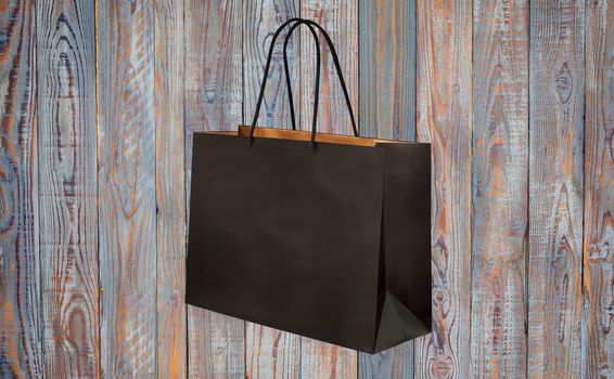 paper bag for shopping on a wooden background