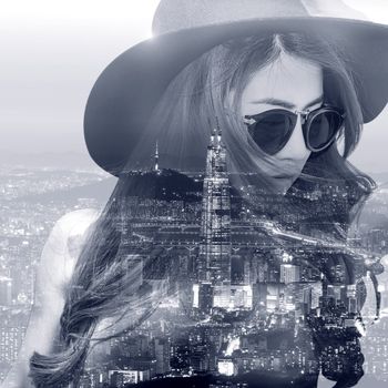 Double exposure,Beautiful girl and cityscape. Black and white tone.