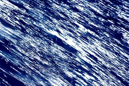 Blurred blue, white and black diagonal background
