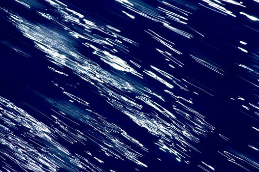Blurred blue, white and black diagonal background