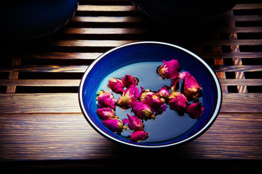 Chinese Tea rose studio quality dark background