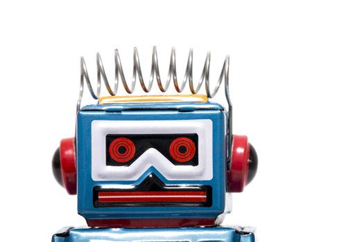 Vintage tin robot toy isolated on a white background.