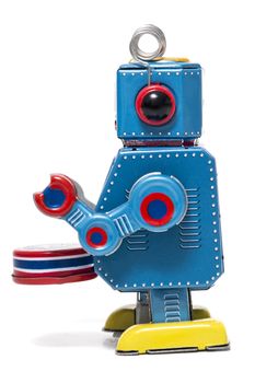 Vintage tin robot toy isolated on a white background.