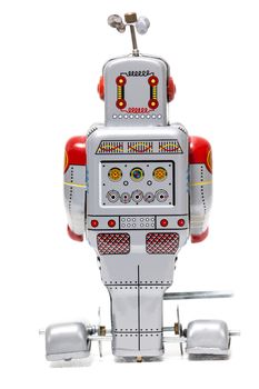 Vintage tin robot toy isolated on a white background.