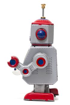 Vintage tin robot toy isolated on a white background.