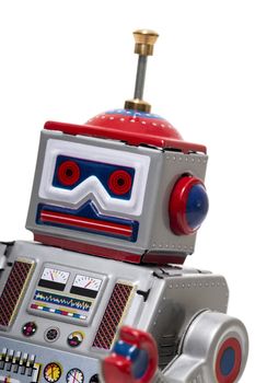 Vintage tin robot toy isolated on a white background.