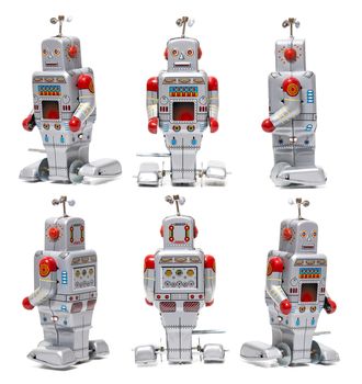 Vintage tin robot toy isolated on a white background.