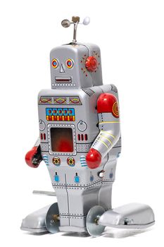 Vintage tin robot toy isolated on a white background.