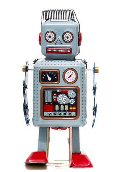 Vintage tin robot toy isolated on a white background.