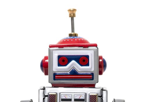 Vintage tin robot toy isolated on a white background.