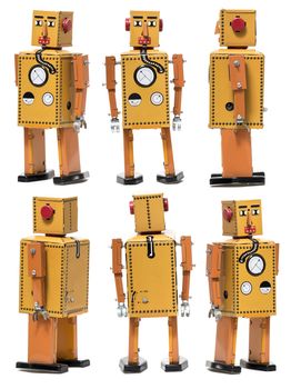 Vintage tin robot toy isolated on a white background.
