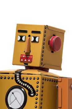 Vintage tin robot toy isolated on a white background.