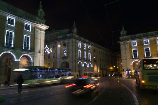 Night traffic in commerce plaza in the city of Lisbon, Portugal.