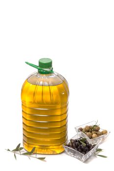 Green and black olives with olive oil bottle isolated on a white background.