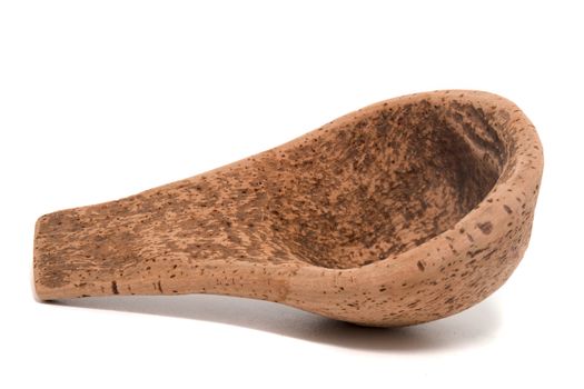 Close up view detail of a traditional handmade drinking utensil called "cocho" or "cocharro" carved from cork from the interior regions of Portugal.
