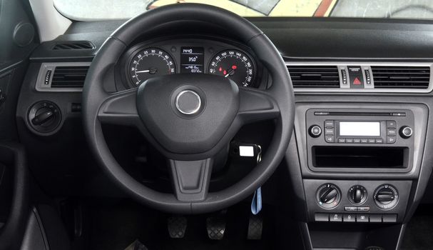 Empty modern car cockpit with steering wheel