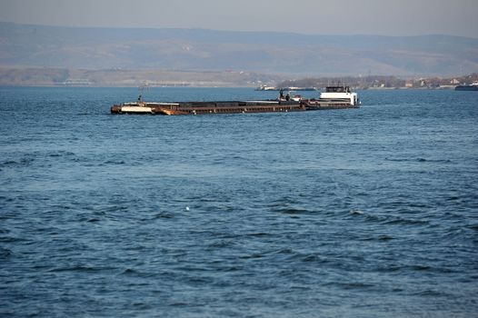 Cargo ship on the way to main river port
