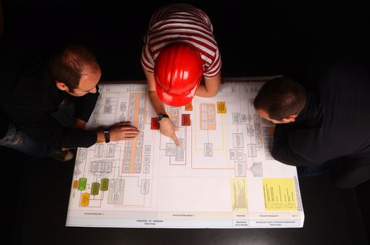 Worker with Scheme of detailed business plan