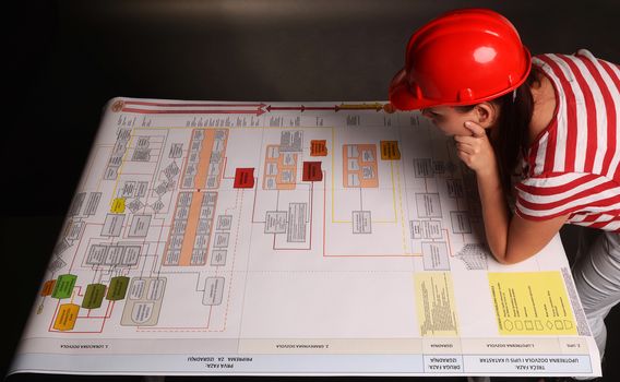 Worker with Scheme of detailed business plan