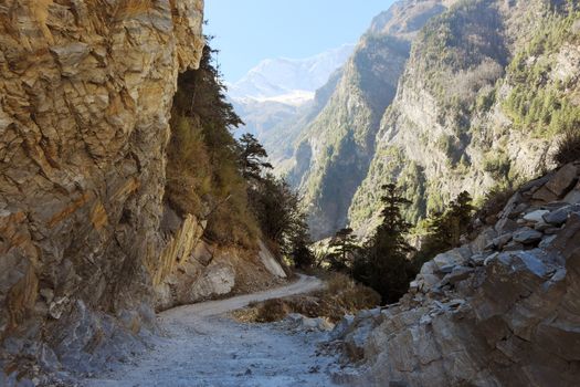 road in a mountain gorge in nepalese himalayas