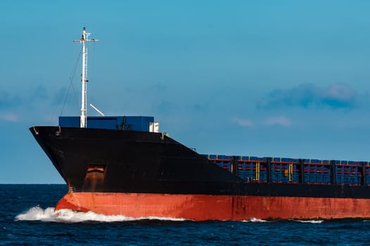 Black bulker ship. Logistics and merchandise transportations