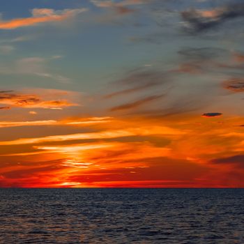 Hot and romantic sunset over the Baltic sea. Calm landscape